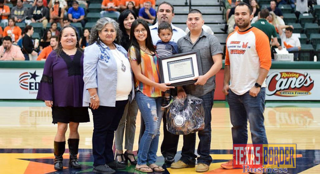 Amanda Cruz, an interdisciplinary studies sophomore at UTRGV, won the 2019 Family of the Year essay. Shown here surrounded by her son, husband and other family members who are helping her achieve her dreams of graduating university, she was recognized at the UTRGV Homecoming Basketball game in February. She was also recognized again by throwing the first pitch at UTRGV Baseball’s Selena Night on April 6 in Edinburg. (Courtesy Photo)