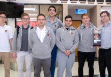 The UTRGV Vaqueros Chess Team returned to the Rio Grande Valley just after 12 a.m. Monday from New York City, riding its second consecutive national win over rival Webster University in the Final Four of Collegiate Chess. The team is seen here just after arrival at the Brownsville South Padre Island International Airport. Coach Bartek Macieja, far right, proudly displays the President’s Cup trophy. (UTRGV Photo by David Pike)