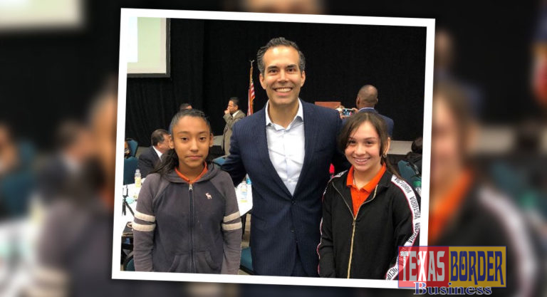 Commissioner meeting students at the conference