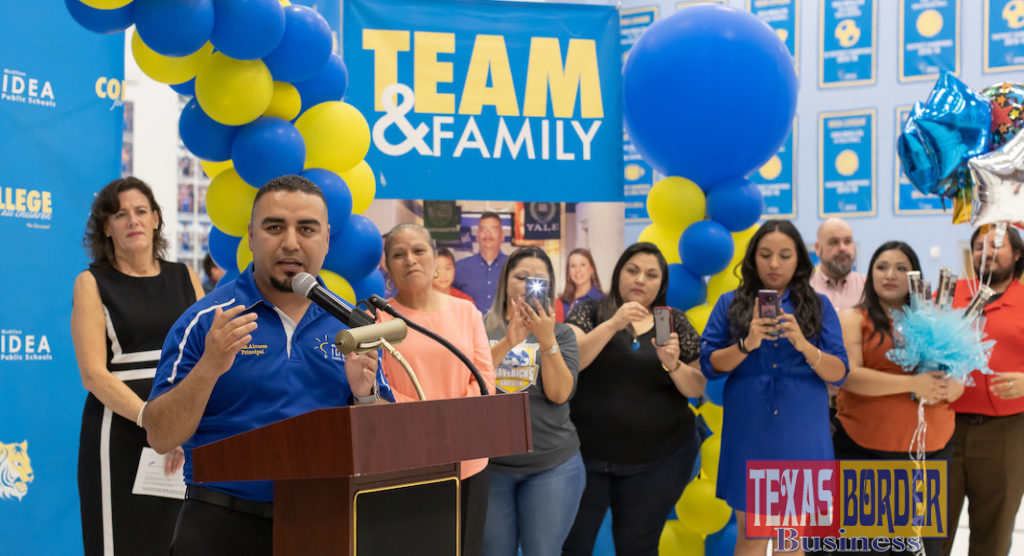IDEA College Preparatory McAllen Principal Joán Alvarez addresses the crowd while family and staff members look on.
