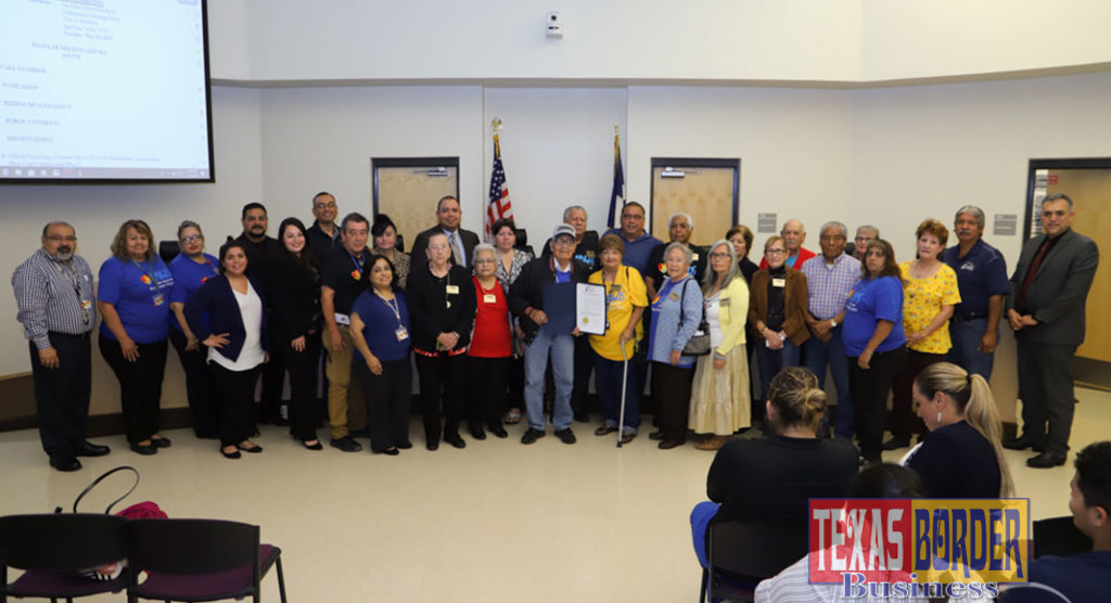 Representatives from Amigos del Valle accept a proclamation declaring May as "Older Americans Month"