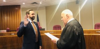 Victor Haddad, taking oath of office as the newly elected McAllen City Commissioner District 5. U. S. Federal Judge Ricardo Hinojosa administering the oath.