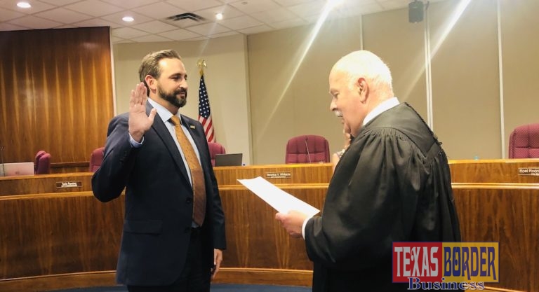 Victor Haddad, taking oath of office as the newly elected McAllen City Commissioner District 5. U. S. Federal Judge Ricardo Hinojosa administering the oath.