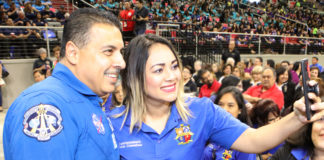 Retired NASA Astronaut Jose Hernandez poses for a selfie with District Parent Round Table Committee Member Angelica Martinez during the Edinburg CISD General Assembly at the Bert Ogden Arena in Edinburg.