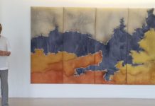 Pictured is Elena Macias, professor of art in the UTRGV School of Art, with an art piece titled "Landscapes," which is currently on exhibit at the UTRGV Performing Arts Complex Lobby in Edinburg. (Courtesy Photo)