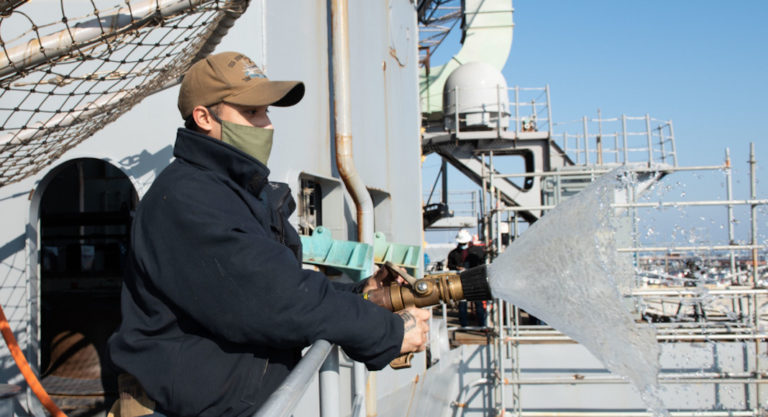 McAllen Sailor performs testing on firefighting hose aboard U.S. Navy warship