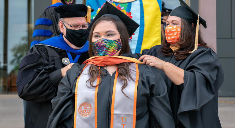 School of Social Work graduates celebrate with loved ones at drive-through hooding ceremony