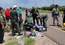 Border PAStrol Agents assist at the scene of an accident. Image courtesy f U.S. Customs and Border Protection.