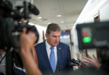 U.S. Senator Joe Manchin III, D-West Virginia, spoke with reporters at the Dirksen Senate Office Building in Washington, D.C., on June 24, 2021. Photo Credit: Rod Lamkey/CNP/Sipa USA via REUTERS