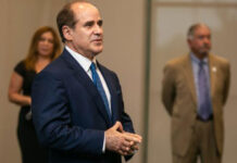 South Texas College President Dr. Ricardo J. Solis shares his vision for the college as Board Chair Rose Benavidez and Trustee Paul R. Rodriguez (background) look on. At a special reception at STC's Pecan campus July 29, Dr. Solis gathered with trustees and the search committee which assisted in his placement as the college's next president. STC Image