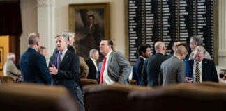 Legislators talk on the House floor on July 29, 2021. Credit: Sophie Park/The Texas Tribune