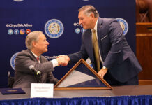 Texas Governor Greg Abbott being greeted by McAllen Mayor Javier Villalobos at the McAllen City Hall. Image: Office Of The Governor