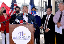 McAllen Mayor Javier Villalobos at the podium. Back row, Governor-Elect of Nuevo Leon, Samuel Garcia and his wife; Hidalgo Mayor Sergio Coronado; Juan Olaguibel, Superintendent of McAllen-Hidalgo International Bridge & Anzalduas International Bridge and Mayor of Mission Mayor Dr. Armando O’Caña at the Hidalgo-McAllen International Bridge. Photo by Roberto Hugo Gonzalez.