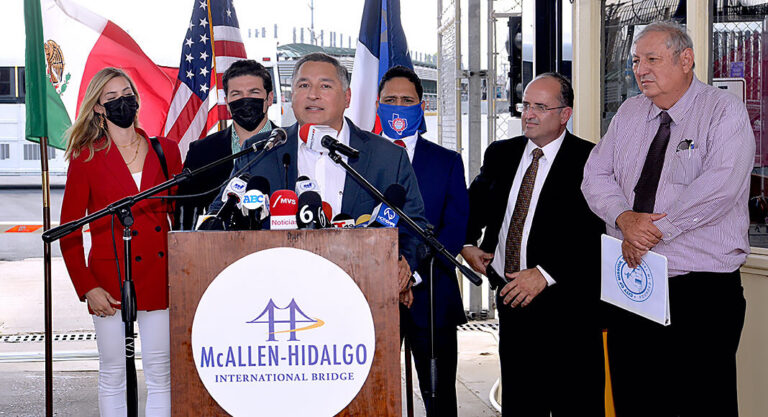 McAllen Mayor Javier Villalobos at the podium. Back row, Governor-Elect of Nuevo Leon, Samuel Garcia and his wife; Hidalgo Mayor Sergio Coronado; Juan Olaguibel, Superintendent of McAllen-Hidalgo International Bridge & Anzalduas International Bridge and Mayor of Mission Mayor Dr. Armando O’Caña at the Hidalgo-McAllen International Bridge. Photo by Roberto Hugo Gonzalez.