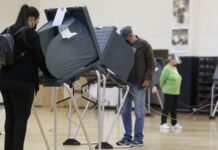 People vote inside the gym at the Metropolitan Multi-Services Center in Houston on Nov. 3. Photo Credit:  Michael Stravato for The Texas Tribune