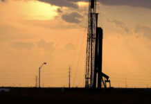 A drilling rig at sunset operates on the north side of Midland. Photo Credit:  Jerod Foster for The Texas Tribune