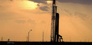 A drilling rig at sunset operates on the north side of Midland. Photo Credit:  Jerod Foster for The Texas Tribune