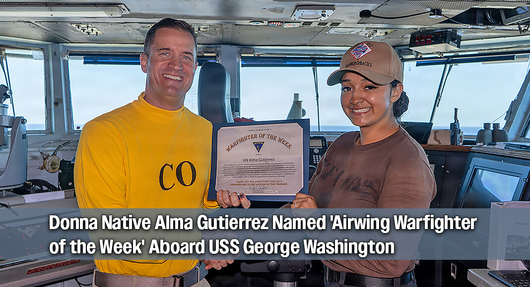 Capt. Nicholas DeLeo, left, commanding officer of Nimitz-class aircraft carrier USS George Washington (CVN 73), congratulates Airman Alma Gutierrez, from Texas, assigned to Strike Fighter Squadron (VFA) 102, during a Warfighter of the Week award presentation while underway in the Philippine Sea, July 1, 2026. The George Washington Carrier Strike Group (GWACSG) is operating in the U.S. 7th Fleet area of operations. George Washington is the U.S. Navy's premier forward-deployed aircraft carrier, a long-standing symbol of the United States' commitment to maintaining a free and open Indo-Pacific, while operating alongside allies and partners across the U.S. Navy's largest numbered fleet. (U.S. Navy photo by Mass Communication Specialist Seaman Andrew Novak). Photo By Seaman Apprentice Andrew Novak