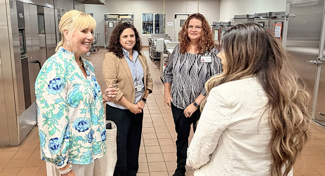 Erin Tawney (left) meets with officials from McAllen ISD's Central Kitchen during a visit held August 14, 2026. Courtesy image