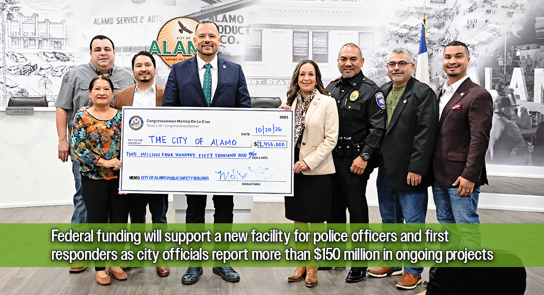 U.S. Rep. Monica De La Cruz joins Alamo Mayor JG Garza, Police Chief Saul Solis, and other city officials in holding a ceremonial $2.4 million check representing federal funding secured for a new public safety building in Alamo, Texas. The investment will support improved facilities for the city's police officers and first responders. Photo by Noah Mangum González / Texas Border Business.